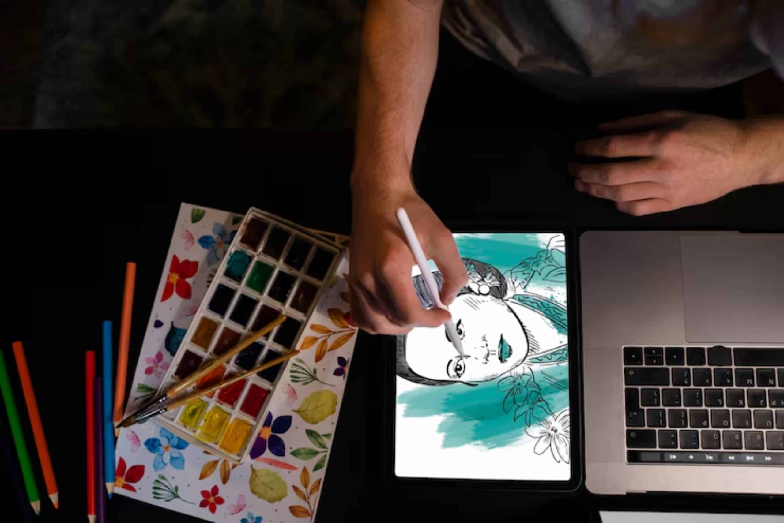 A person drawing on a tablet with an illustration of a woman, surrounded by watercolor paints and colored pencils.